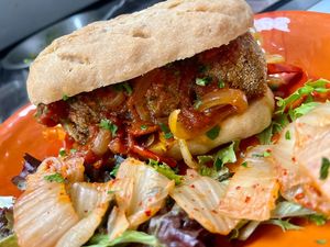 NEW! Lentil ball sandwich. house made lentil balls, house made marinara source and chipotle adobo sauce, caramelized onion and red bell pepper, gluten free hm bun at Botanika Cafe in Ridgefield