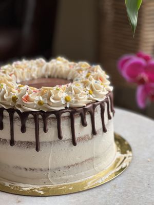 Vegan triple-layer almond sponge with almond buttercream and chocolate ganache drip  at Cakestar Dayton in Dayton