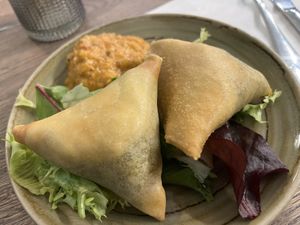 Samosa with salad greens and some kind of Chutney. These were not greasy at all.  So wonderful.    at Le Petit Veg in Paris