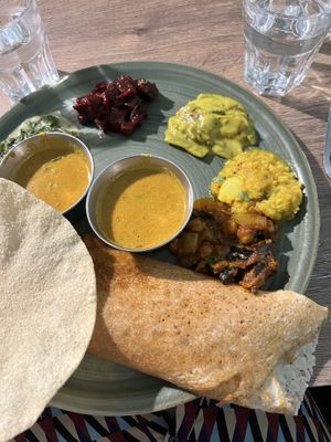 Dosa gourmand, crepe filled with soft potatoes and different sauces around   at Le Petit Veg in Paris