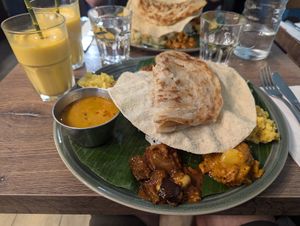 Vegan thali with a mango lassi at Le Petit Veg in Paris