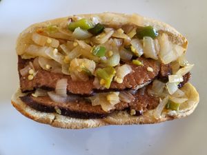 Our hot beef-like seitan sandwich with sauteed onions and peppers at MF Good Food in Riverside