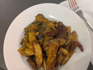 Fruit & root curry with masala chips at Food Works Sharrow in Sheffield