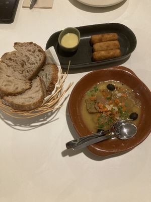 Pica pau, sourdough bread and croquettes  at A Minha Avó in Lisbon