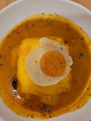 Francesinha with fake egg at A Minha Avó in Lisbon