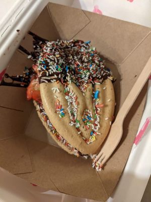 Eve waffle with dark chocolate, strawberry and colorful sprinkles at Adam & Eve Waffles in Berlin