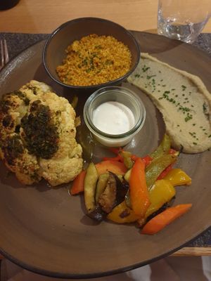 Cauliflower smoky grilled, curry couscous, baba ganoush, mint yoghurt, grilles veggies at Hornox in Zermatt