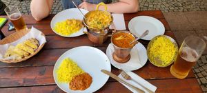 Vegetarian Korma, Dal Makhani, Jeera Rice and some type of Indian bread filled with potatoes, cheese and garlic. at Taj Mahal  in Decin