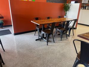 One larger table for six guests. Restaurant has eight total tables for guests. New wall was built to create a small intimate, cozy dining area. at 3 in 1 Restaurant in Indianapolis