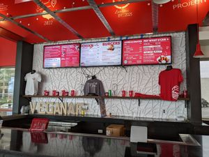 Menu and merchandise at Project Pollo in Dallas