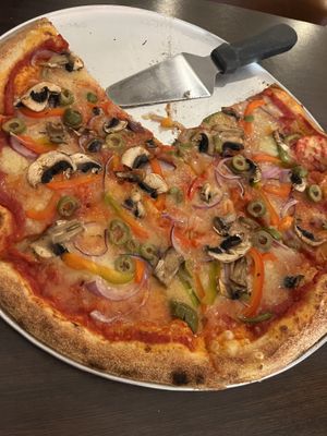 Large pizza with vegan cheese, mushrooms, onion, olives and paprika/bell pepper.  at Mika in Reykholt