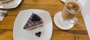 Blueberry cheesecake and coffee at Mantra Alimentación Consciente in Tarapoto