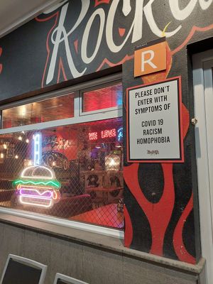 Anti racist and homophobic sign at the door at Rockabilly in Gran Canaria