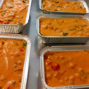 Chickpeas, cherry tomatoes and spinach in charred pepper and coconut sauce. Part of the meal delivery service. at Fairfoods in Willand