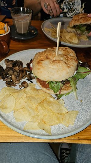 Vegan schnitzel burger with a side of mushrooms at Freudian Sip in Leura