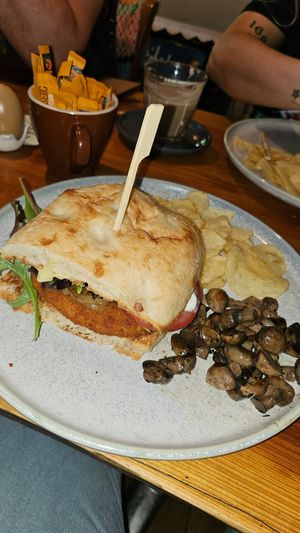 Vegan schnitzel burger with a side of mushrooms at Freudian Sip in Leura