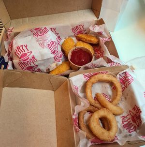 Garlicious burger, onion rings and nuggets. at Dirty Vegan - Barcode Street Food in Oslo