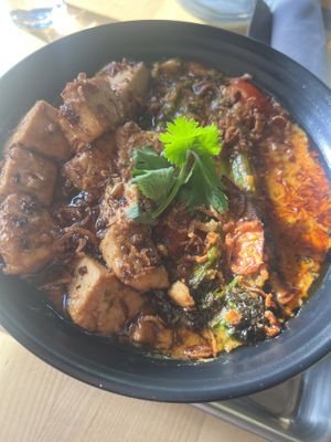 Red Curry & Grits w/ Tofu  at Cinder Restaurant in Westerly