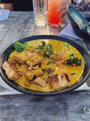 Curry on mushroom grits. This is my preference but the tofu was soft and I don’t like that. You honestly didn’t need the tofu it was a hit without it   at Cinder Restaurant in Westerly