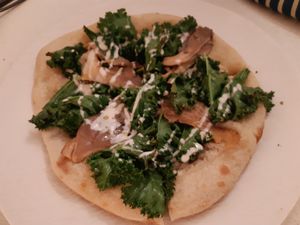 Main / Pizza truffata at MUDRA Plant Based  in Madrid