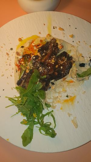 Hummus con berenjena de maracuyá at MUDRA Plant Based  in Madrid