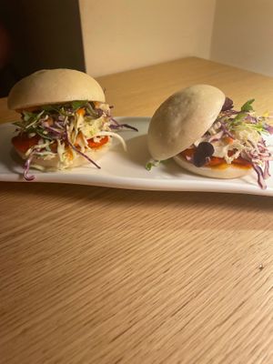 Bao buns - with carrots, mustard and coleslaw at MUDRA Plant Based  in Madrid
