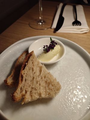 Courtesy bread and butter starter at MUDRA Plant Based  in Madrid