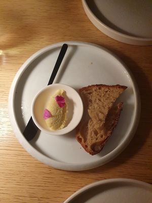 Complimentary bread with coconut mango btter at MUDRA Plant Based  in Madrid