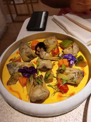 Artichoke with cream and paprika oil - was the best! at MUDRA Plant Based  in Madrid