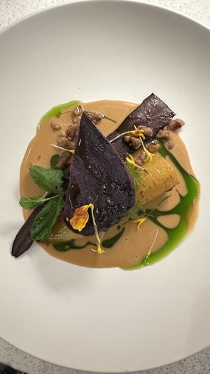 Carrots & sweet potato in tamari demi glace sauce with parsley oil  at MUDRA Plant Based  in Madrid