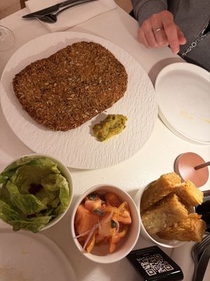 Schnitzel to share with sides  at MUDRA Plant Based  in Madrid