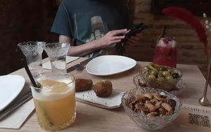 First cocktails with croquettes, olives and spicy nuts. at Amberes The Vegetarian Wine And Cocktail Bar in Valencia