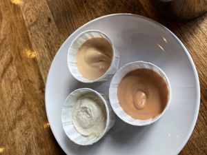 Horseradish aioli, buffalo aioli, and fry sauce. All vegan and gluten-free   at The Wild Hare in Stillwater