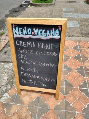 Daily menu on chalkboard outside at Las Veganas in Medellin