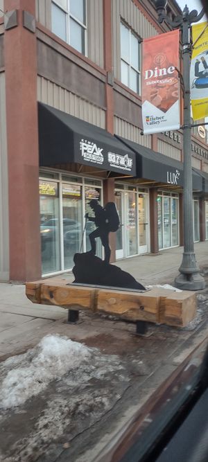 Landmark:  If parking along main street, look for this metal/wood sign of a mountain climber, then walk between two nearby buildings, to reach restaurant entrance. at Mountain Wellness in Heber City