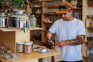 Customer filling up a free paper bag at Ethikli in Long Beach
