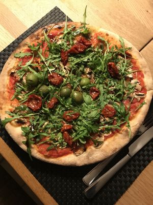 Veggie Pizza Funghi without cheese-added some Rocket salad and dried tomatoes instead   at Pizza Garten in Zingst