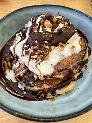 Sweet pancakes with chocolate syrupp  at BRÛLÉ in Toulouse