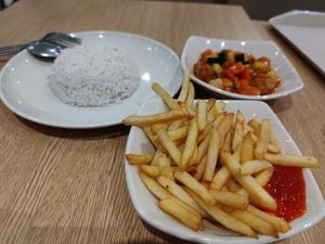 sweet and sour chicken rice with fries at Nyonya Vege in Kuala Lumpur