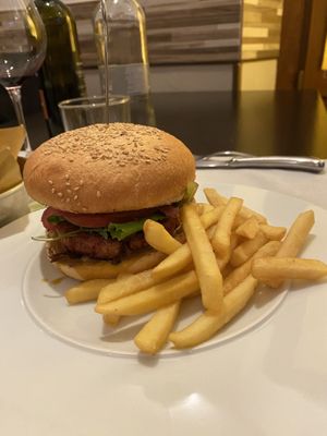 vegan burger that comes with fries  at La Gasthaus Bistrot in Bergamo