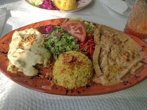Seitan stroganoff and tofu main, plus rice and salad. at Oasis Vegetariano - Marques de Sa da Bandeira in Lisbon