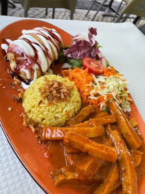 Seitan with spicy sause, rice, salad and puff pastry  at Oasis Vegetariano - Marques de Sa da Bandeira in Lisbon