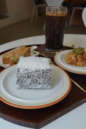 Lamington, cheese biscuit, iced black coffee  at Bgomi in Seoul