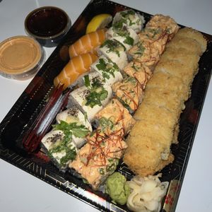 salmon nigiri, umami roll, tiger roll, and eureka roll (L to R)  at Gorilla Eats Sushi in San Diego