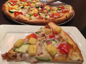 Vegan Cashew Thai Curry Pizza - with coconut red curry sauce, vegan cheese, zucchini, red pepper, cashews, cilantro, onion, fresh pineapple at Renee's Organic Oven in Tucson