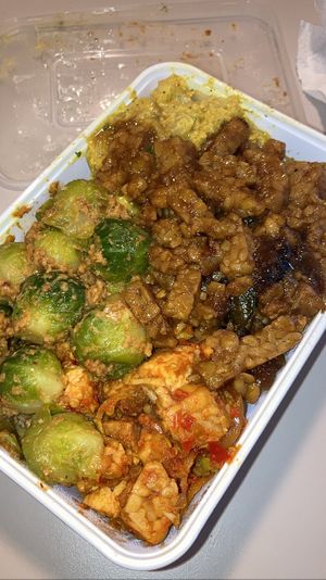 Some vegan dishes (cauliflower in curry sauce, jackfruit in peanut sauce, tempeh, spicy tofu and tempeh, brussel sprouts in creamy peanut sauce)  at Toko Pedis in Utrecht