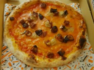 Sausage and crispy potatoes pizza at Freezza in Barcelona