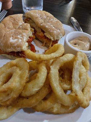 Chicken Parmesan sandwich with onion rings  at Jordan's Homeside Pub in Hamilton