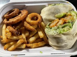 Chicken Caesar wrap with side of onion rings and fries  at Jordan's Homeside Pub in Hamilton