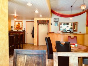 The inside of the charming restaurant at Maharadja Chez Chander in Sion